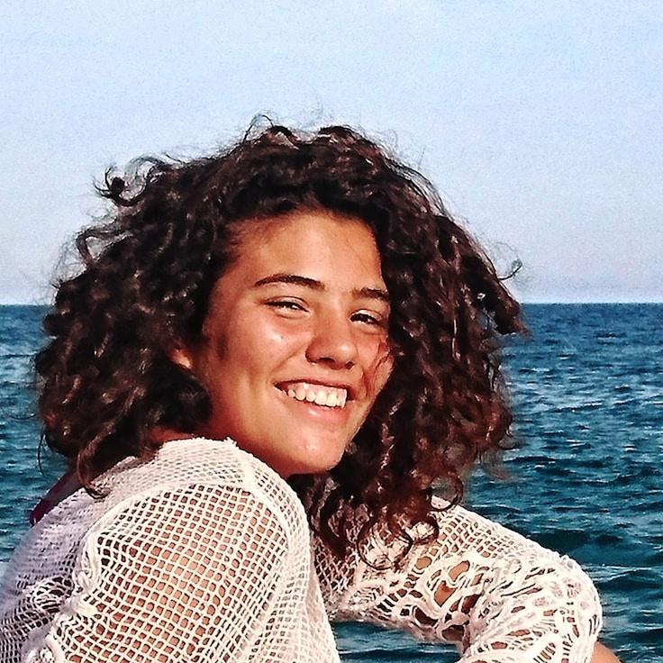 Avery Chen, Lead Design Curator at PebbleGroveAtlas, reviewing corporate floral arrangements